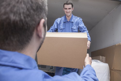 Removal van and moving boxes outside a Hammersmith home