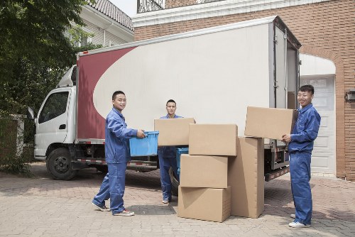 Moving team handling a flat removal in a busy Hammersmith street