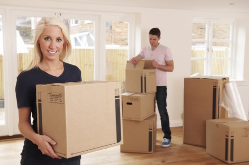 Professional packers preparing household items for a local move