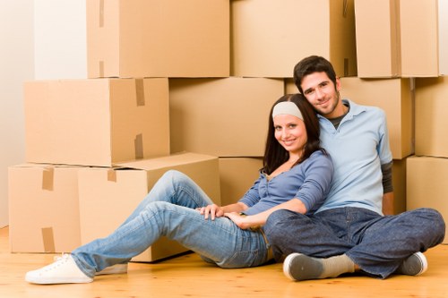 Professional movers handling boxes and furniture during a Hammersmith removal