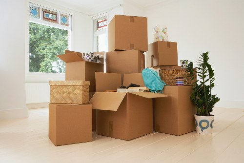 Packed office boxes and furniture ready for a business move